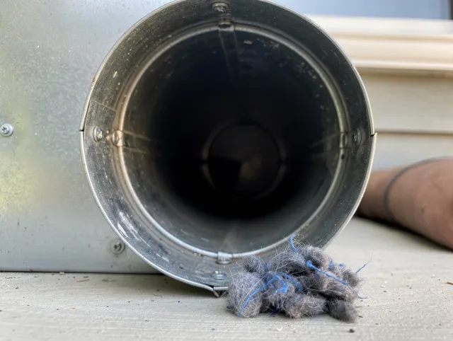 Bell Gardens Dryer Vent Cleaning technician using specialized equipment to clear severe dryer vent blockage in Bell Gardens